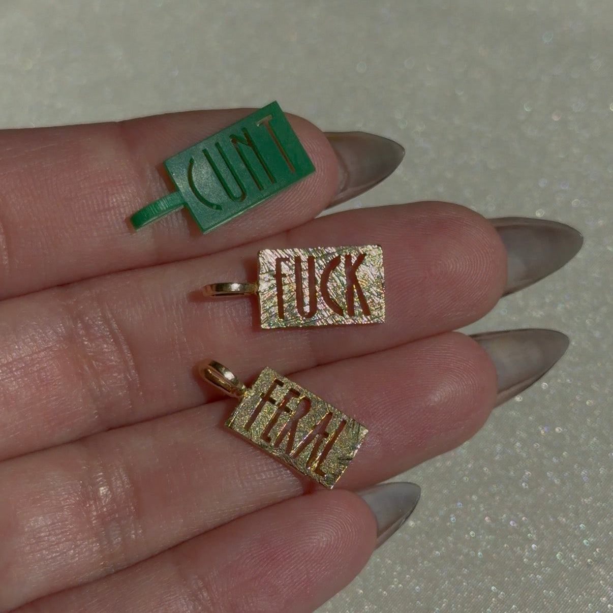 c*nt pendant in 18k yellow gold by universal deco